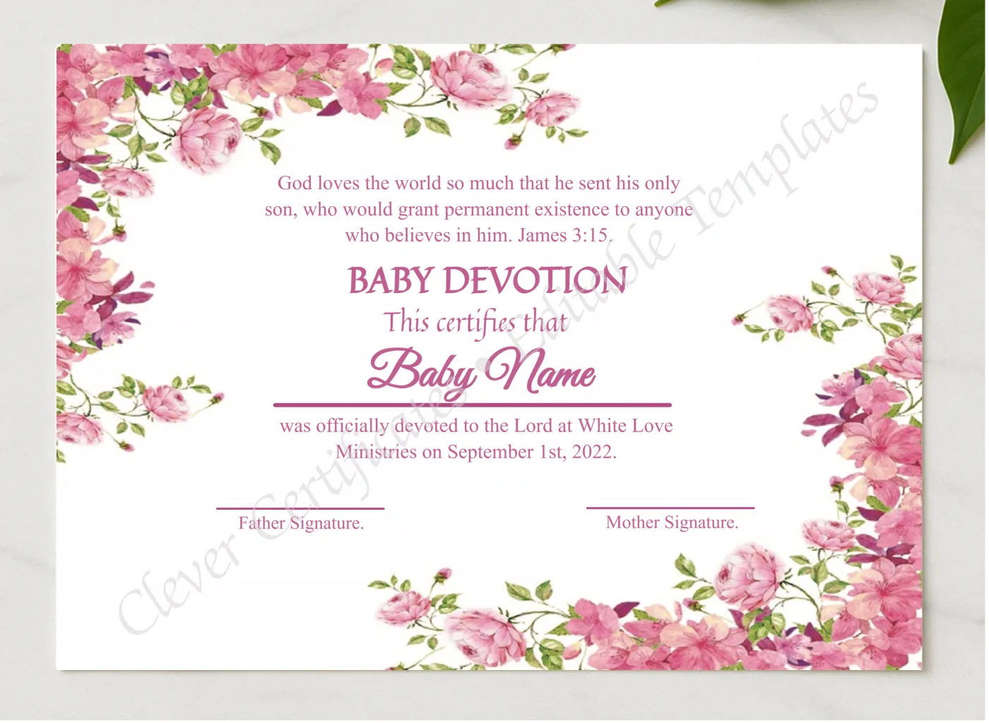 Editable Floral Baby Devotion Certificate presented in a sleek wooden frame, elegantly arranged on a stylish table.
