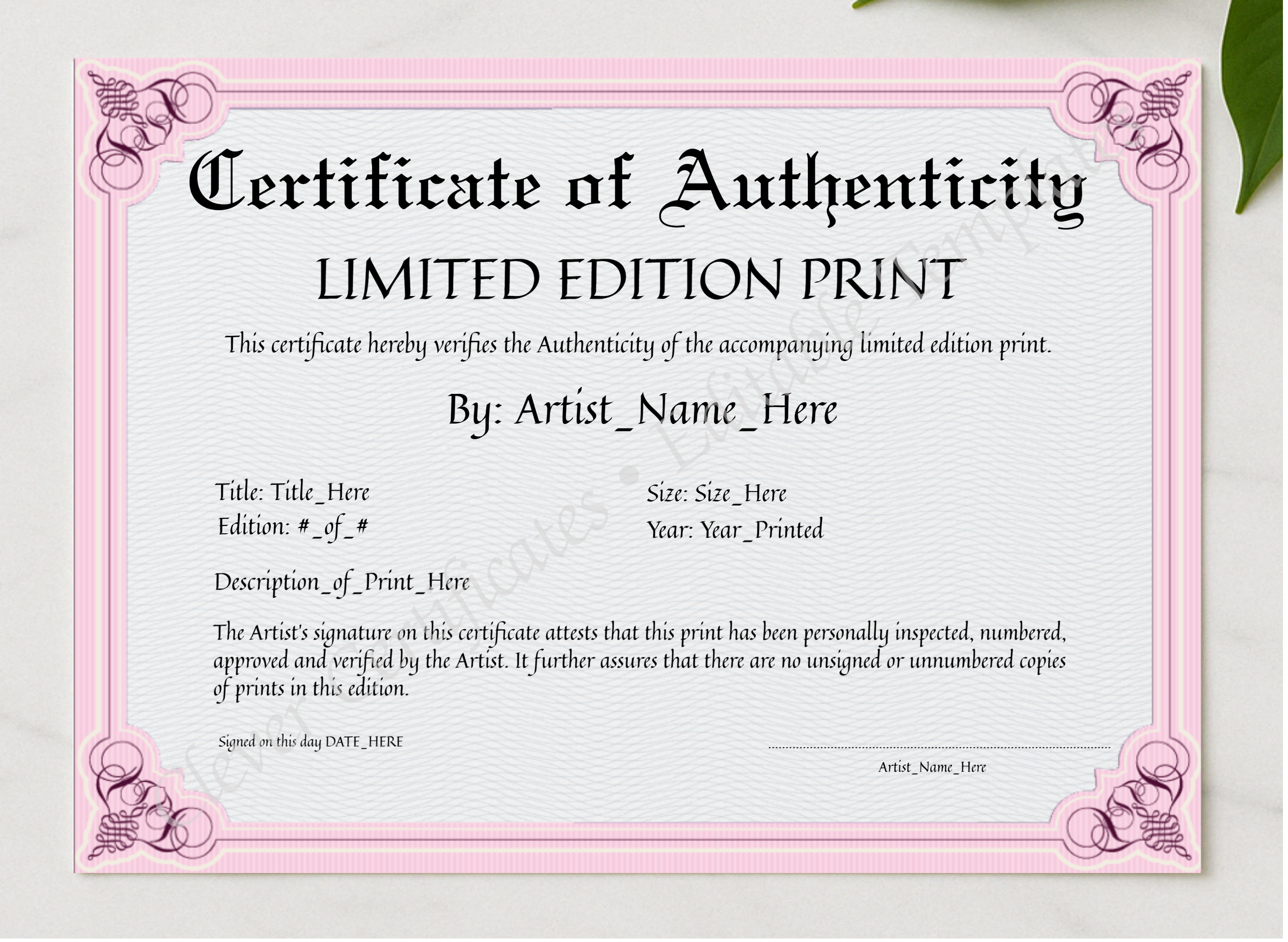 Customizeable Pink Certificate Of Authenticity presented in a sleek wooden frame, elegantly arranged on a stylish table.