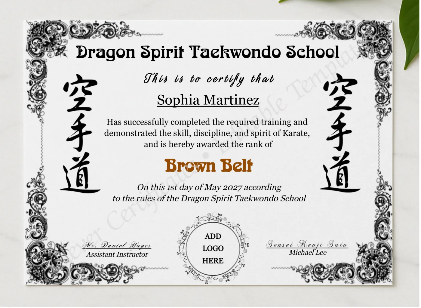 Karate Brown Belt Certificate With Logo presented in a sleek wooden frame, elegantly arranged on a stylish table.